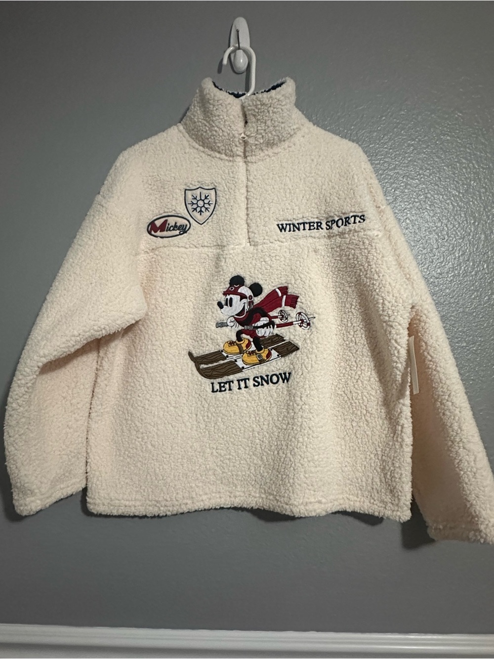 Disney women’s size medium cream sherpa pullover jacket new with tag